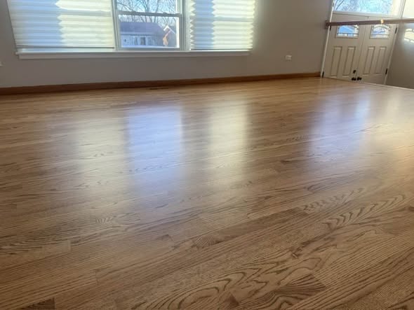 Warm oak hardwood with matching baseboards
