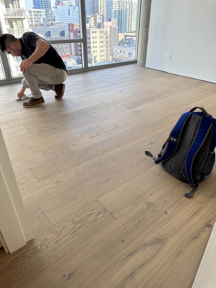 Finished hardwood floor at walls and perimeter details