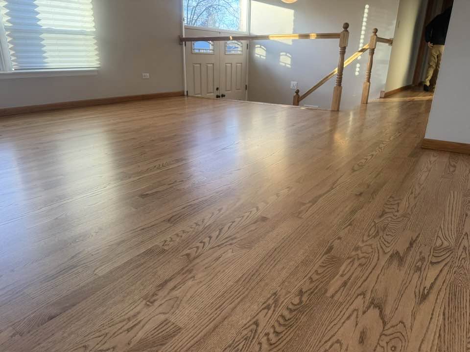 Light hardwood flooring coordinated with stair treads in an MGM Floors project