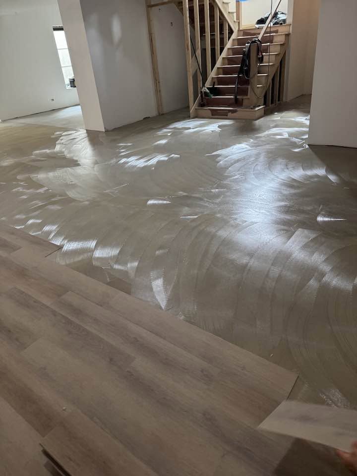 Hardwood floor layout in a bright window-lined room
